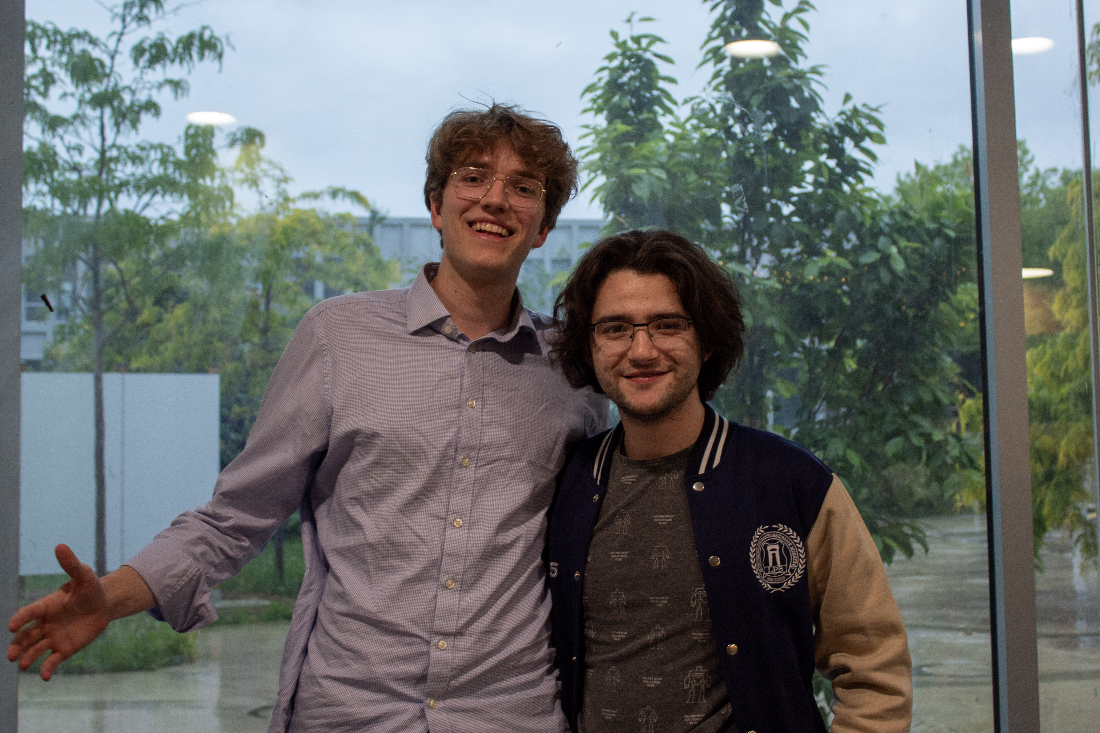 Two students smiling